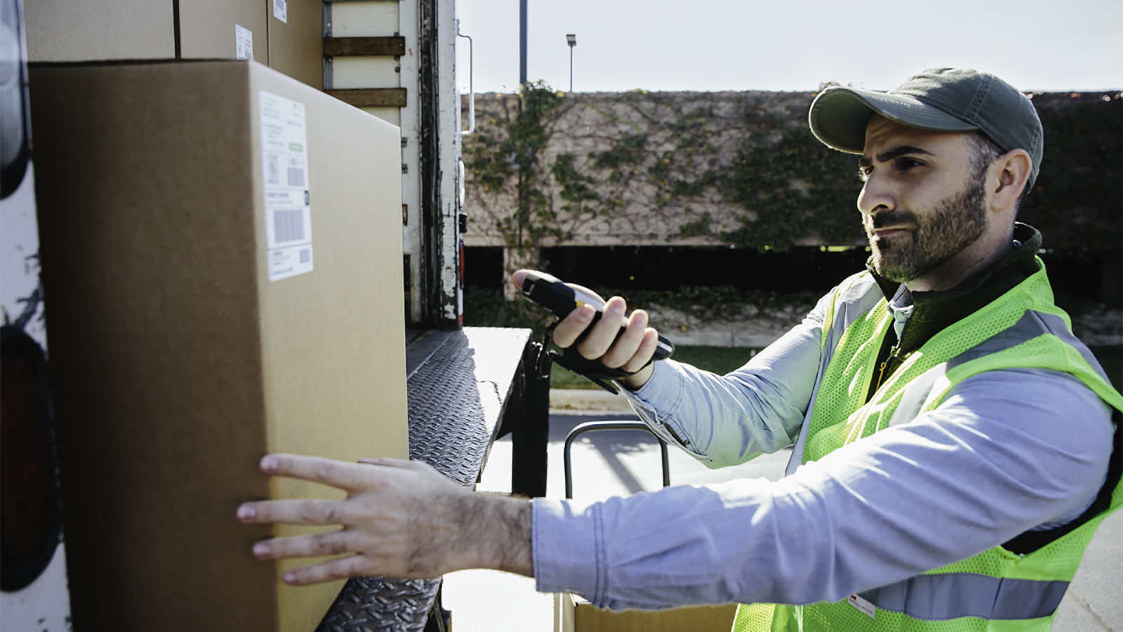 Delivery man with cardboard box