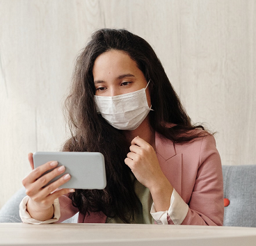 Woman with mask and mobile.png