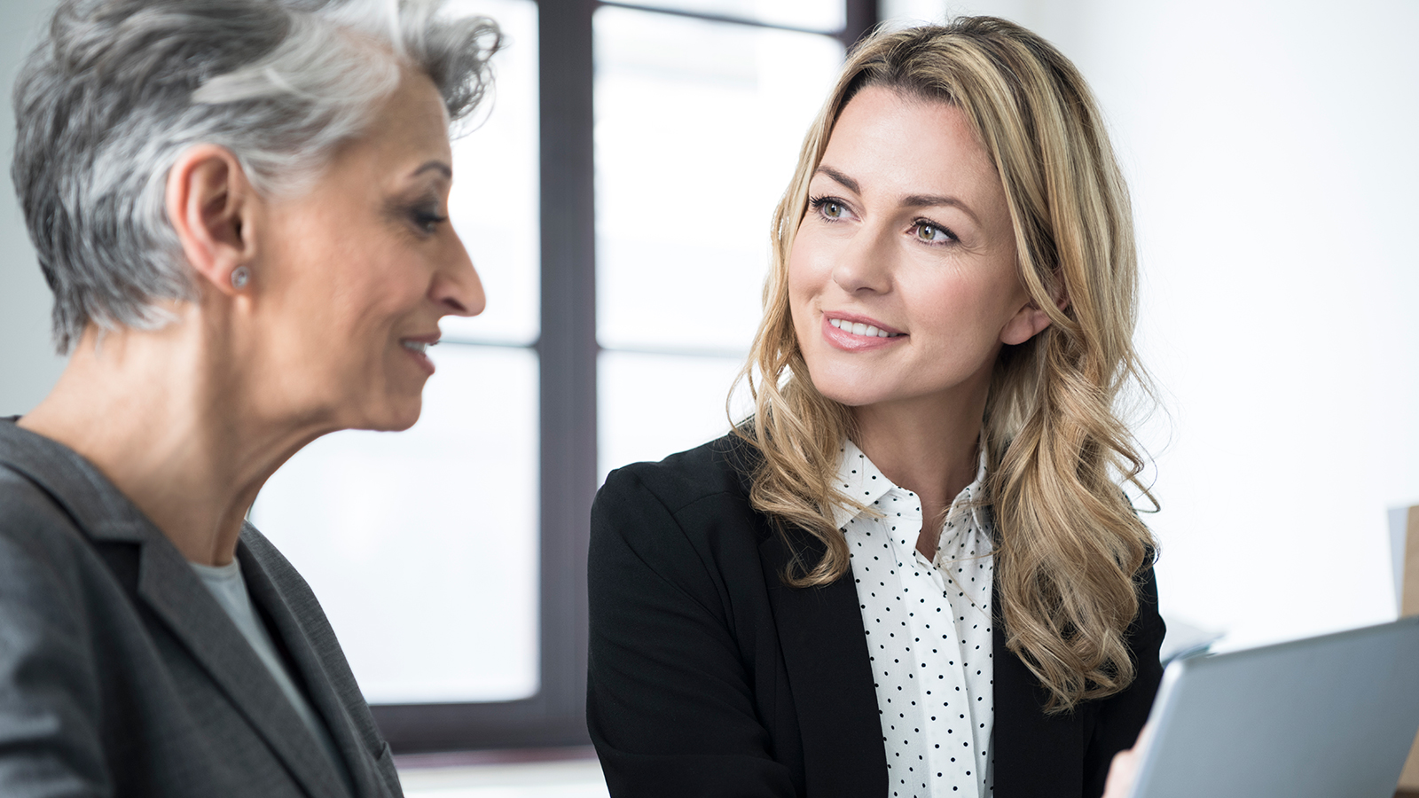 Two women discussing together