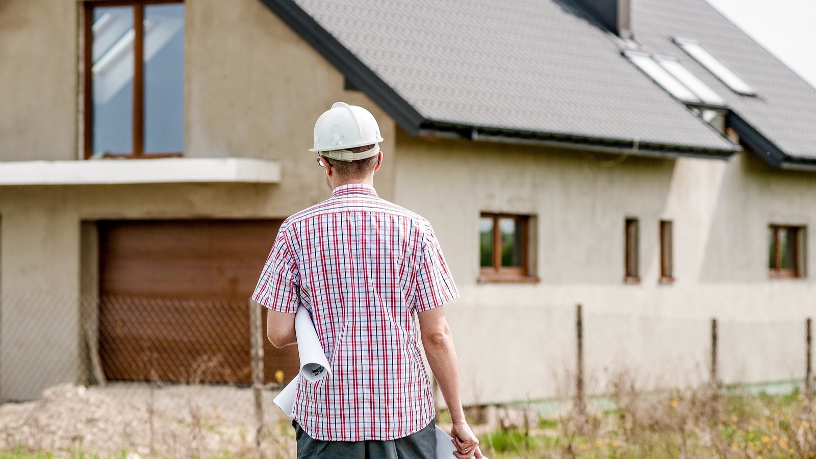 Builder inspector worker checking a construction site works