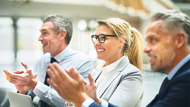 Business people smiling and applaud