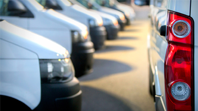 Commercial delivery vans in row at parking place